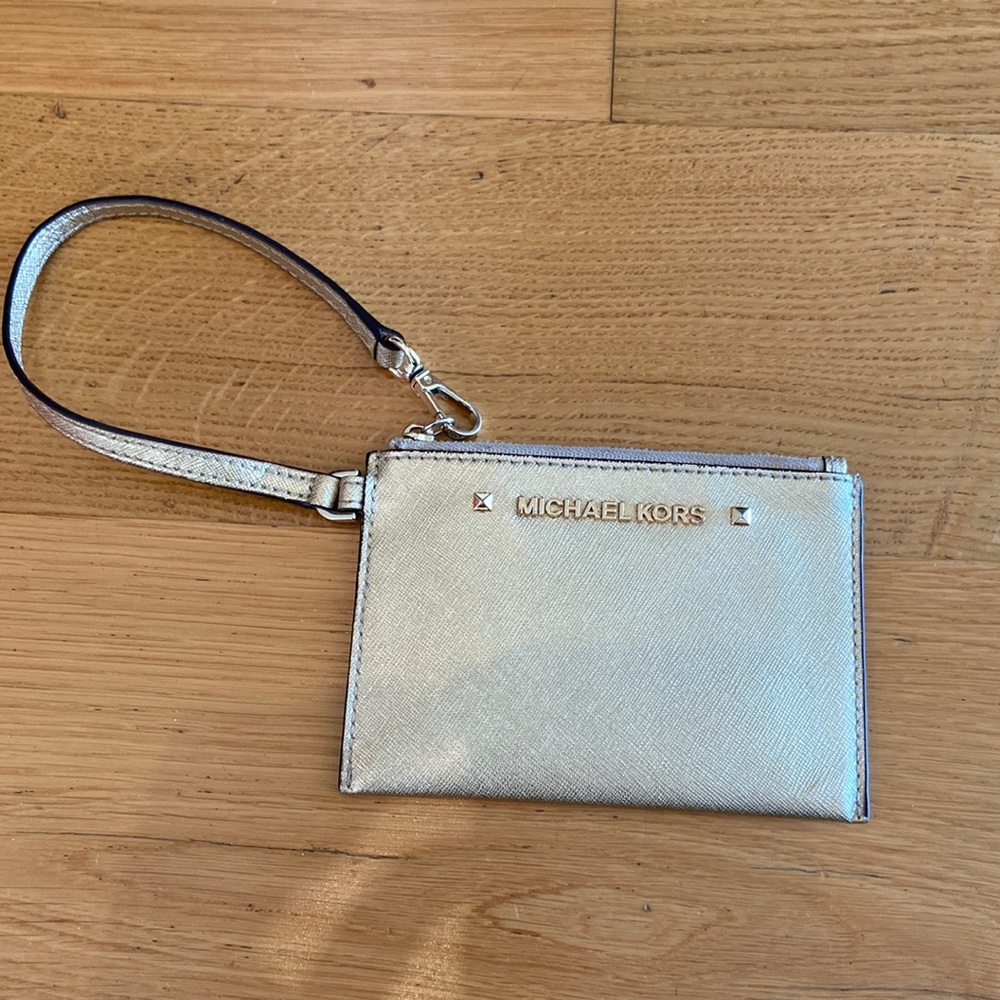 Michael Kors small gold wristlet.
